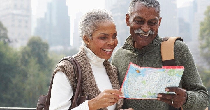 Couple in City with Map, New York City, New York, USA