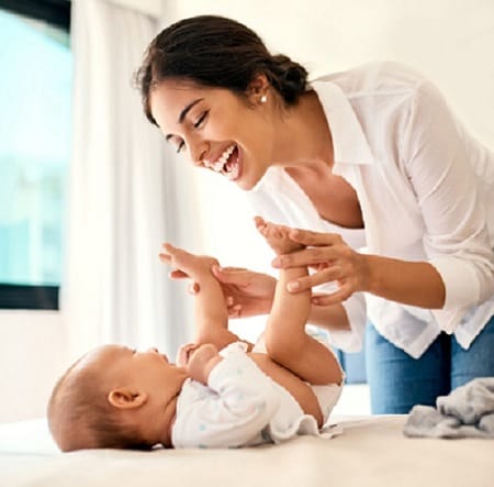 Shot of a happy mother bonding with her baby boy at home